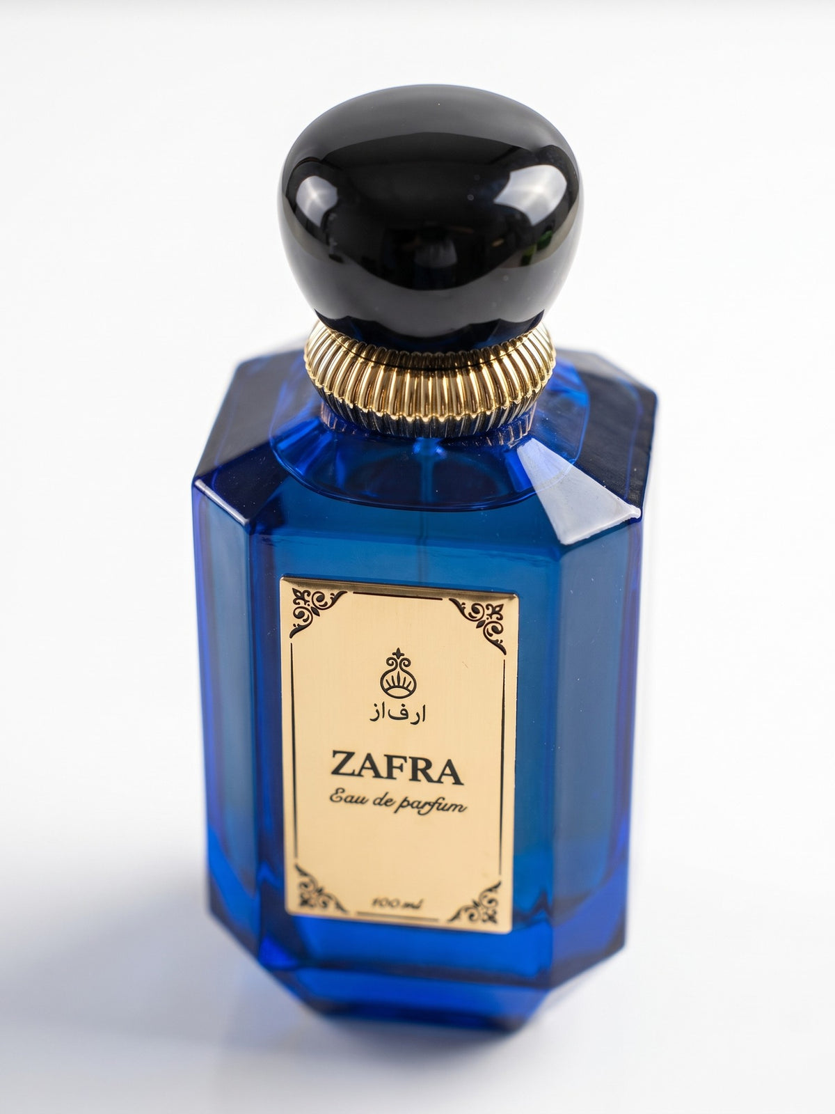 ZAFRA Eau de parfum 100 ml, sticlă albastră — detaliu etichetă și capac