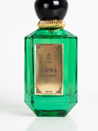 ZAFRA Eau de parfum 100 ml, sticlă verde — detaliu etichetă și capac